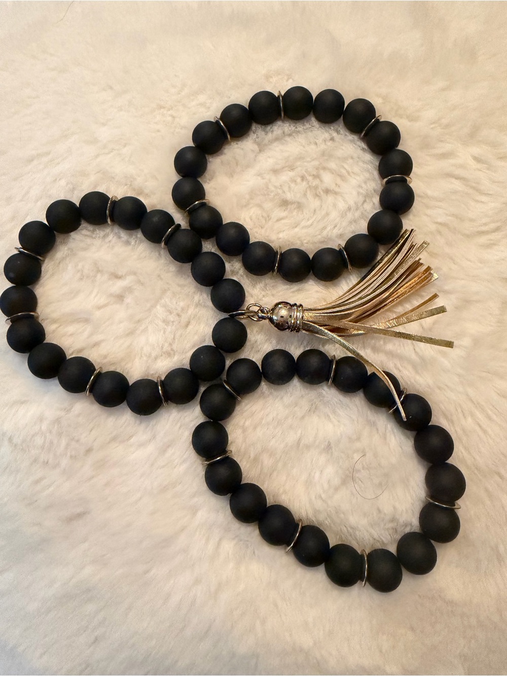 Matte Black Beaded Bracelet Set with Gold Tassel Accent